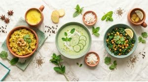 Ayurvedic recipes for your dosha, a Vata, Pitta and Kapha food spread on cream linen